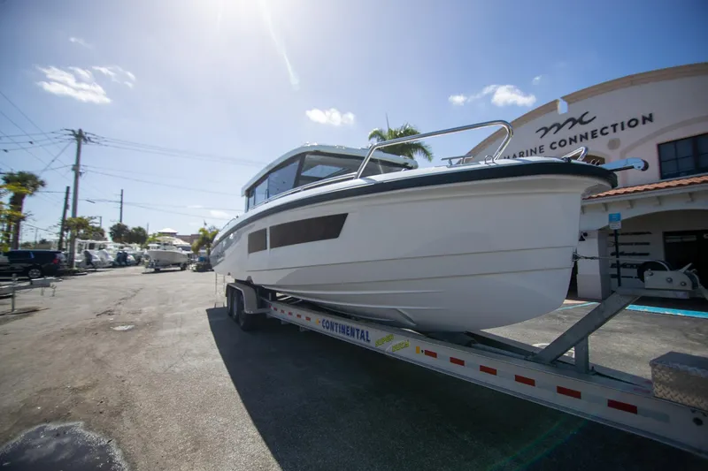 Slide: The Image of 2024 Quarken 35 Cabin boat on trailer at Marine Connection dealership. - 10