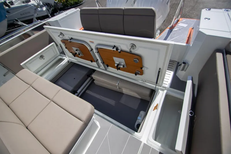 Slide: The Image of 2024 Quarken 35 Cabin boat interior storage compartments and seating area. - 22