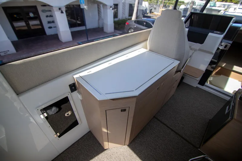 Slide: The Image of Interior of 2024 Quarken 35 Cabin, featuring modern seating and cabinetry design. - 36