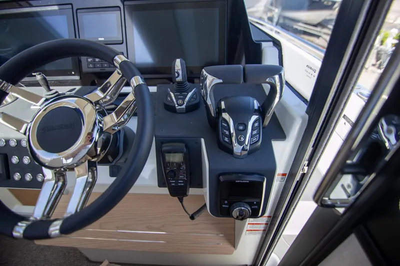 Slide: The Image of 2024 Quarken 35 Cabin helm with modern controls and steering wheel. - 46