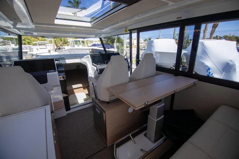 Slide: The Image of 2024 Quarken 35 Cabin interior with modern seating and panoramic windows. - 32