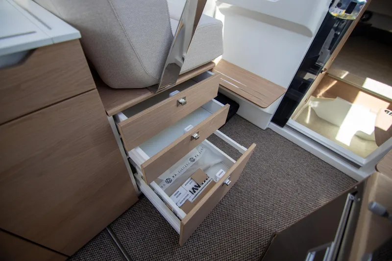 Slide: The Image of 2024 Quarken 35 Cabin interior with open wooden drawers and modern design. - 40