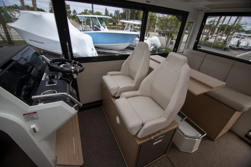 Slide: The Image of Interior of 2024 Quarken 35 Cabin boat with modern seating and helm. - 42