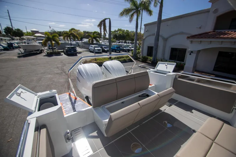 Slide: The Image of 2024 Quarken 35 Cabin boat with spacious seating and storage, parked outdoors. - 19