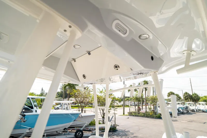 Slide: The Image of 2024 Cobia 301 CC boat interior, showcasing modern design and features. - 16
