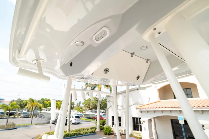 Slide: The Image of 2024 Cobia 301 CC boat, showcasing sleek design and modern features. - 17