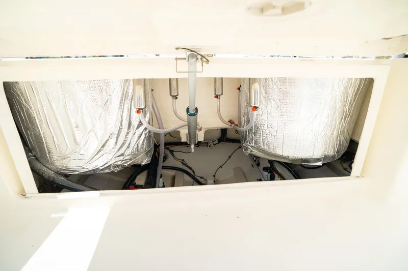 Slide: The Image of 2024 Cobia 301 CC boat interior wiring and insulation detail. - 28