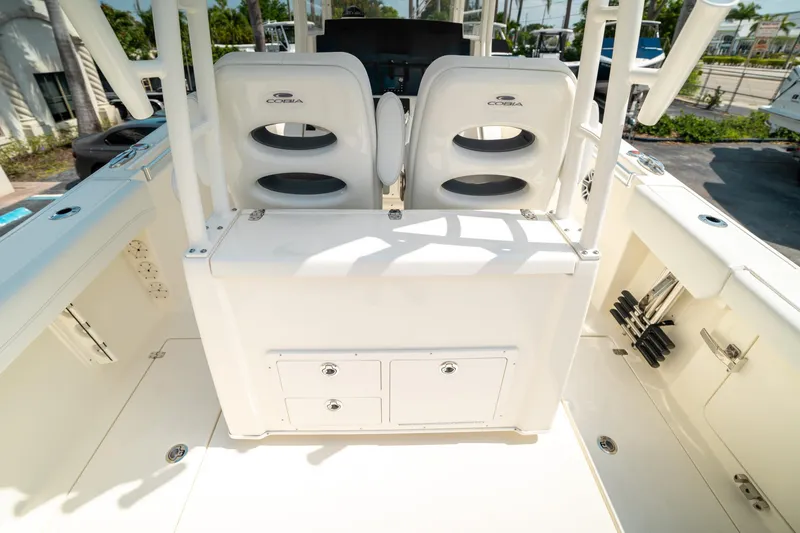 Slide: The Image of 2024 Cobia 301 CC boat interior with seating and storage compartments. - 29