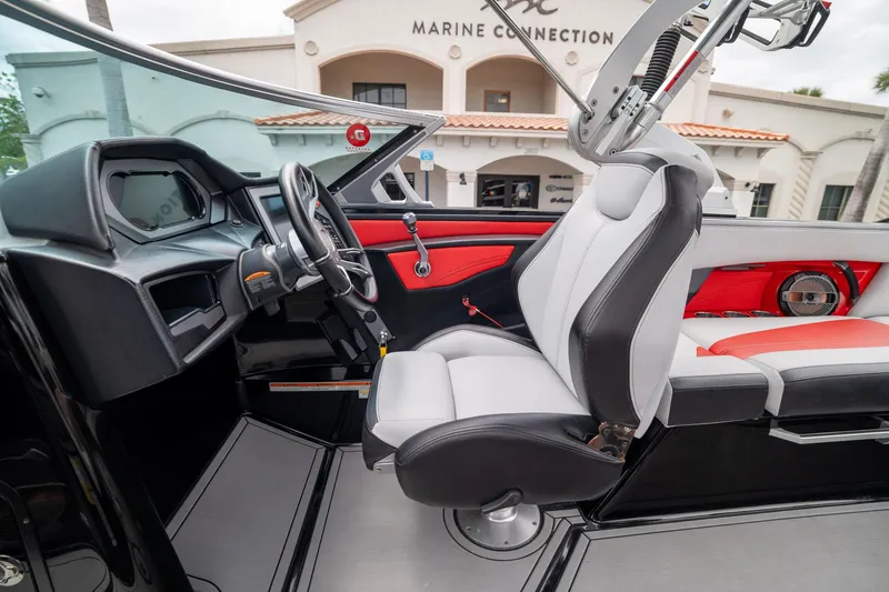 Slide: The Image of 2019 MasterCraft X-Star interior with sleek black and red design, featuring modern dashboard and seating. - 17
