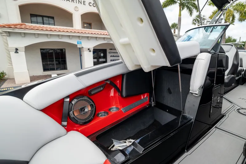 Slide: The Image of 2019 MasterCraft X-Star boat interior with red accents and speaker system. - 26