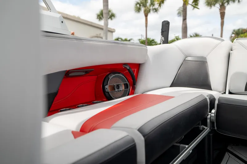 Slide: The Image of 2019 MasterCraft X-Star interior with red and white seating, featuring built-in speaker. - 33