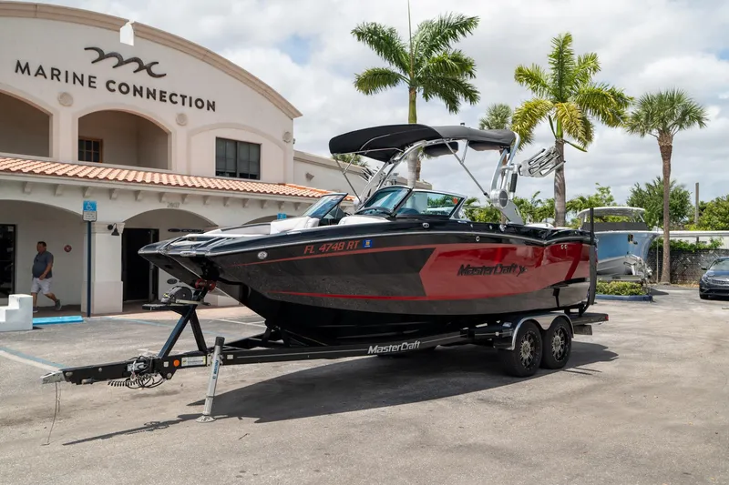 Slide: The Image of 2019 MasterCraft X-Star boat on trailer at Marine Connection dealership. - 4