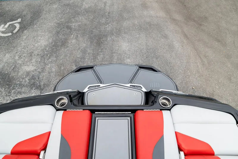 Slide: The Image of 2019 MasterCraft X-Star boat interior with red and white seating, viewed from above. - 40