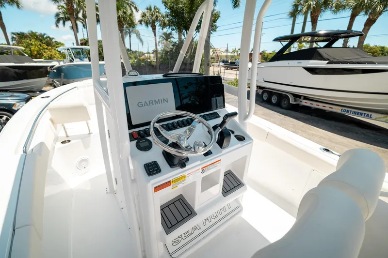 Slide: The Image of 2025 Sea Hunt Ultra 219 boat dashboard with Garmin navigation system. - 11