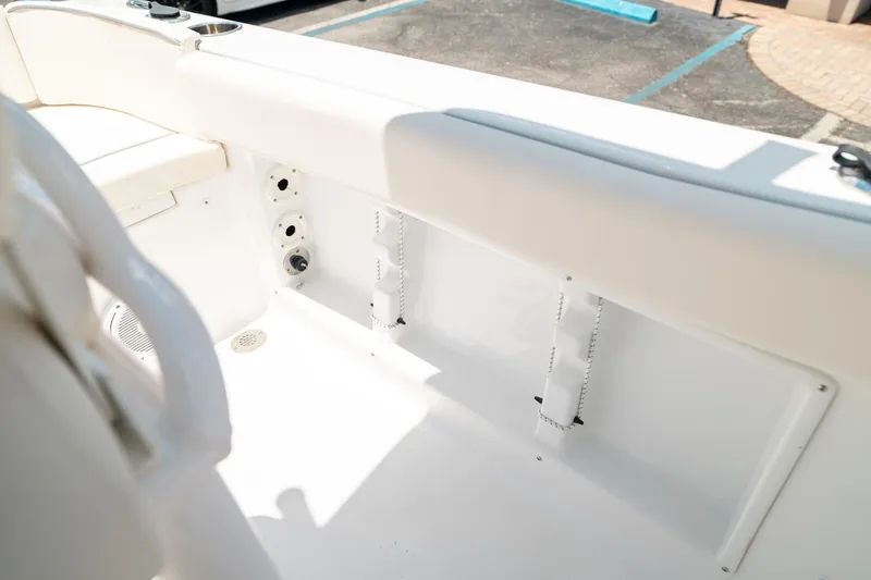 Slide: The Image of Interior view of 2025 Sea Hunt Ultra 219 boat, showcasing seating and storage area. - 26