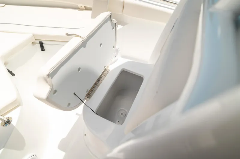 Slide: The Image of Open storage compartment on 2025 Sea Hunt Ultra 219 boat interior. - 34