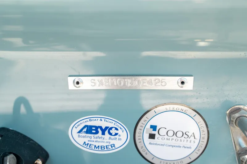 Slide: The Image of 2025 Sea Hunt Ultra 219 boat identification plate with ABYC and Coosa Composites stickers. - 40