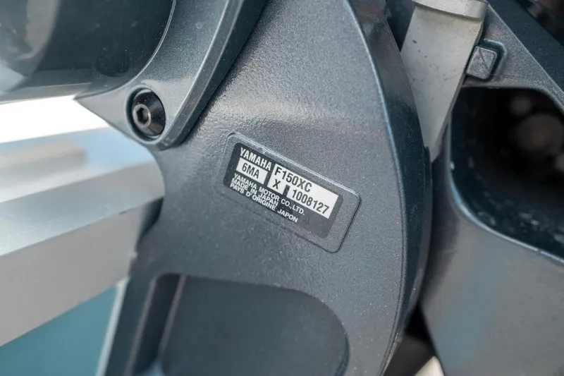Slide: The Image of Close-up of Yamaha F150XC engine label on 2025 Sea Hunt Ultra 219 boat. - 41