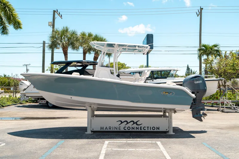 Slide: The Image of 2025 Sea Hunt Ultra 219 boat displayed at Marine Connection dealership. - 5