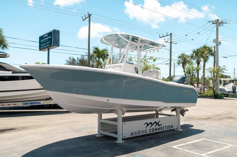 Slide: The Image of 2025 Sea Hunt Ultra 219 boat displayed at Marine Connection dealership. - 6