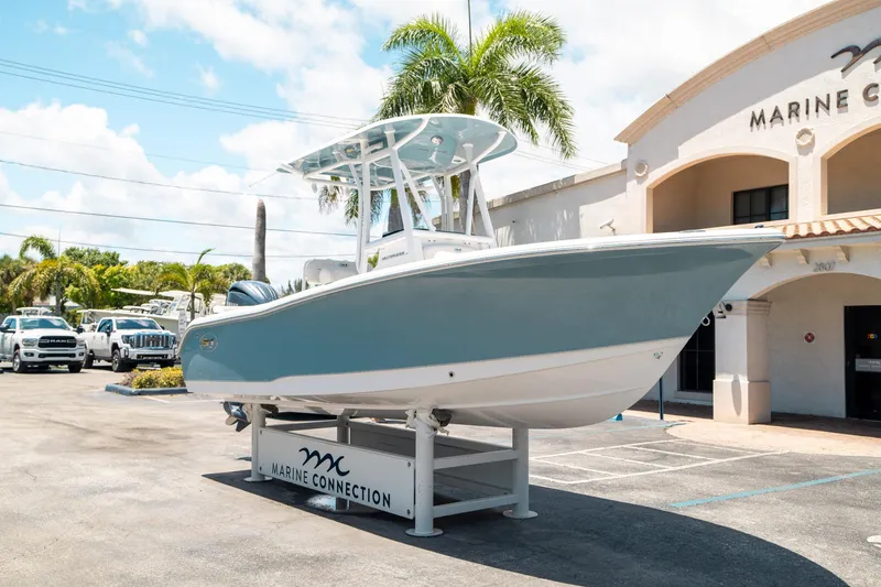 Slide: The Image of 2025 Sea Hunt Ultra 219 boat displayed at Marine Connection dealership. - 8