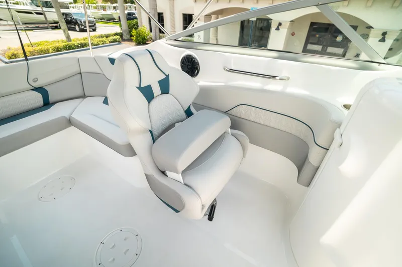 Slide: The Image of 2024 Hurricane SunDeck 2400 OB boat interior with plush seating and modern design. - 19