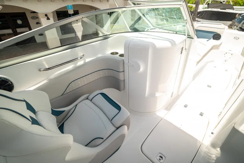 Slide: The Image of 2024 Hurricane SunDeck 2400 OB boat interior with white seating and modern design. - 20