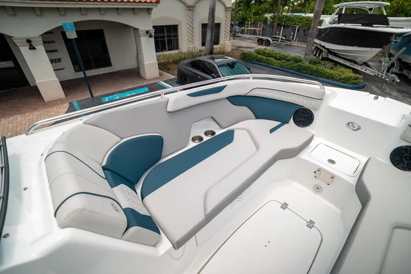 Slide: The Image of 2024 Hurricane SunDeck 2400 OB boat interior with stylish seating and modern design. - 28