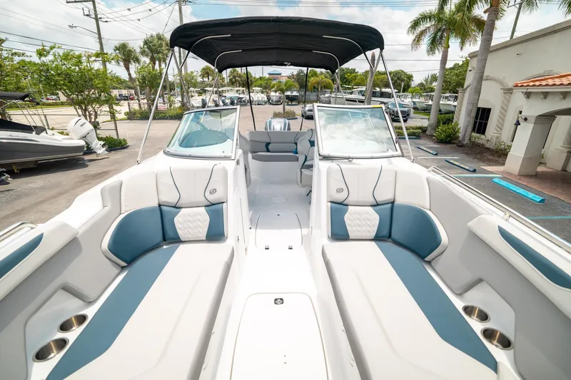 Slide: The Image of 2024 Hurricane SunDeck 2400 OB boat interior with spacious seating and modern design. - 31