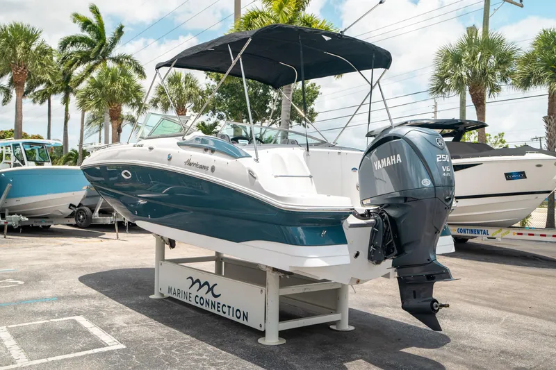 Slide: The Image of 2024 Hurricane SunDeck 2400 OB boat with Yamaha engine on display at Marine Connection. - 4
