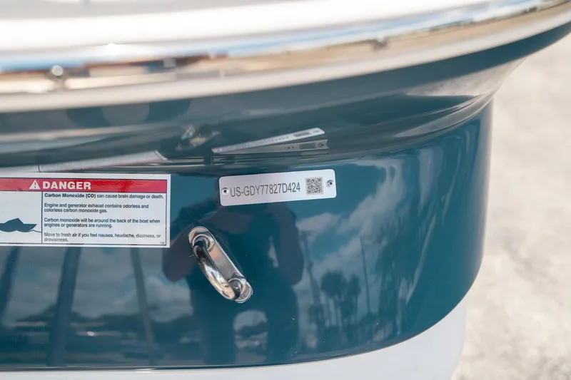 Slide: The Image of Close-up of 2024 Hurricane SunDeck 2400 OB boat with carbon monoxide warning label. - 41