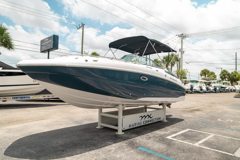 Slide: The Image of 2024 Hurricane SunDeck 2400 OB boat displayed at Marine Connection dealership. - 6