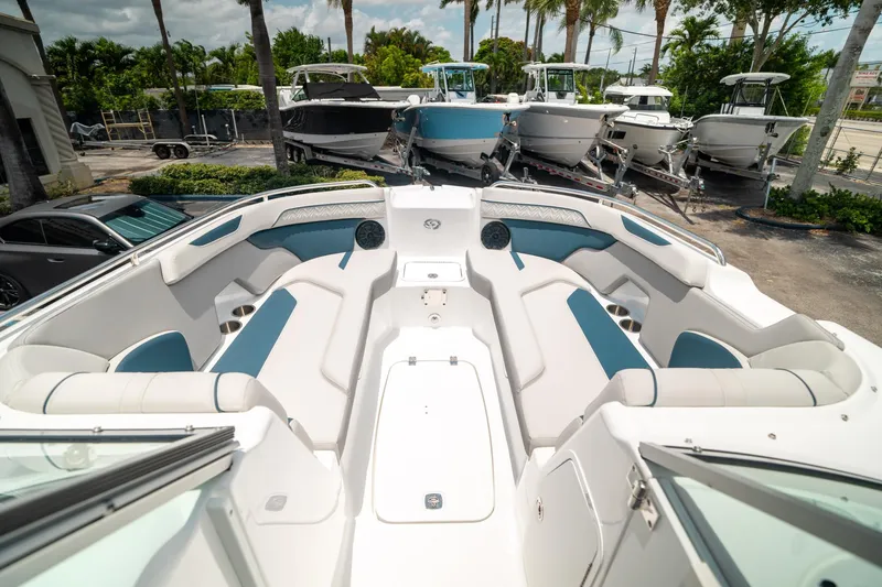 Slide: The Image of 2024 Hurricane SunDeck 2400 OB boat interior with spacious seating and modern design. - 27