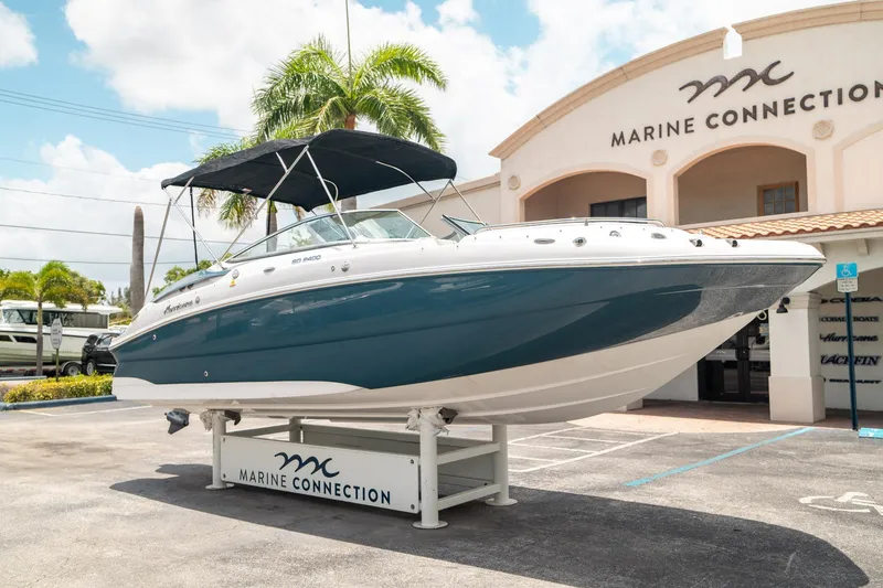 Slide: The Image of 2024 Hurricane SunDeck 2400 OB boat displayed at Marine Connection dealership. - 8