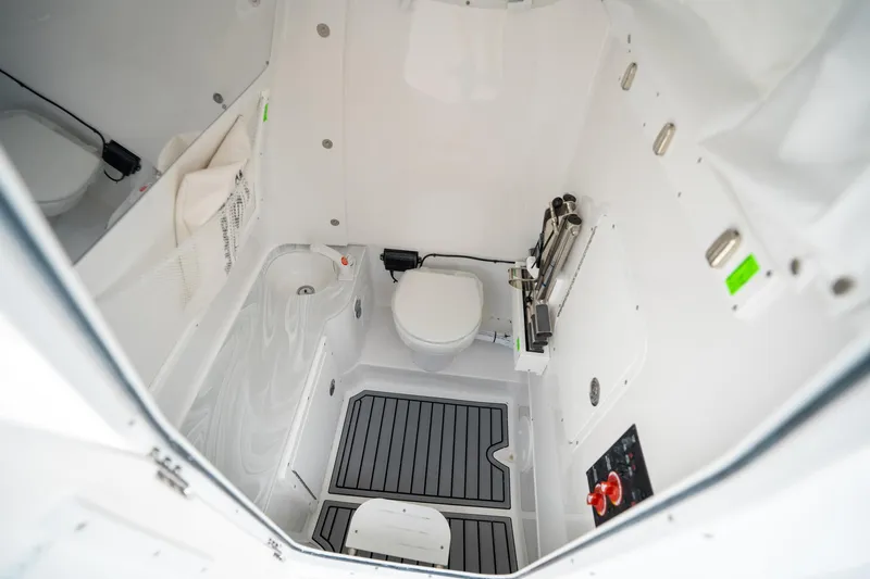 Slide: The Image of Interior of 2025 Sea Hunt Gamefish 28 FS boat bathroom, featuring modern amenities and compact design. - 38