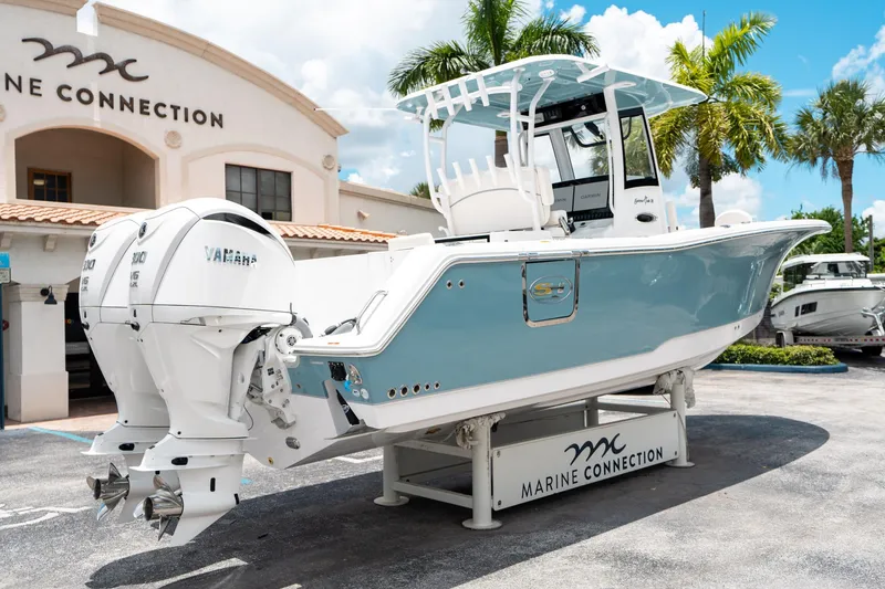 Slide: The Image of 2025 Sea Hunt Gamefish 28 FS boat displayed at Marine Connection dealership. - 2