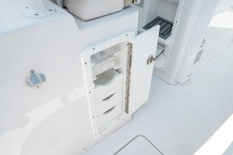 Slide: The Image of Open storage compartment on 2025 Sea Hunt Gamefish 28 FS boat. - 22