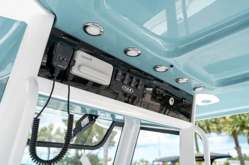 Slide: The Image of 2025 Sea Hunt Gamefish 28 FS console with Garmin electronics and overhead lighting. - 30