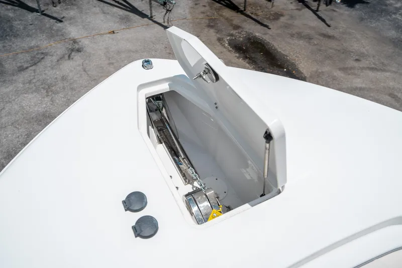 Slide: The Image of Open anchor compartment on 2025 Sea Hunt Gamefish 28 FS boat. - 48