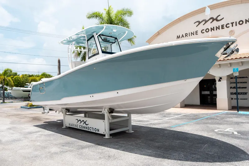 Slide: The Image of 2025 Sea Hunt Gamefish 28 FS boat displayed at Marine Connection dealership. - 8