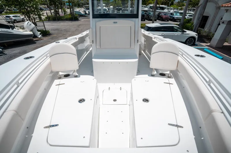 Slide: The Image of 2025 Sea Hunt Gamefish 28 FS boat interior with seating and storage compartments. - 49