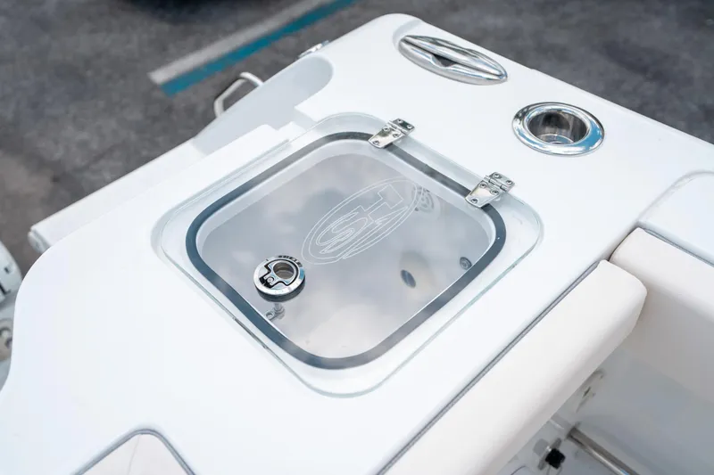 Slide: The Image of 2025 Sea Hunt Gamefish 28 FS boat detail, featuring a sleek livewell with a transparent lid. - 16