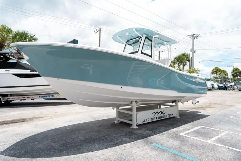 Slide: The Image of 2025 Sea Hunt Gamefish 28 FS boat displayed at Marine Connection dealership. - 6