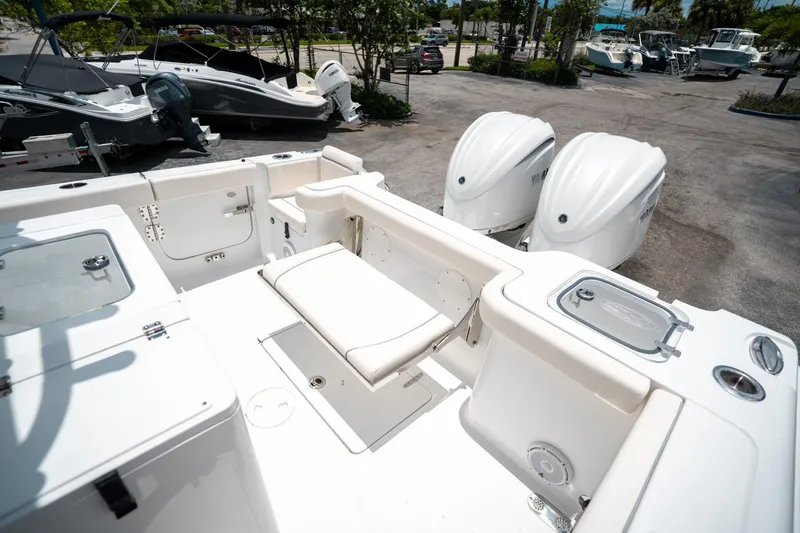 Slide: The Image of 2025 Sea Hunt Gamefish 28 FS boat with dual engines and spacious deck layout. - 13