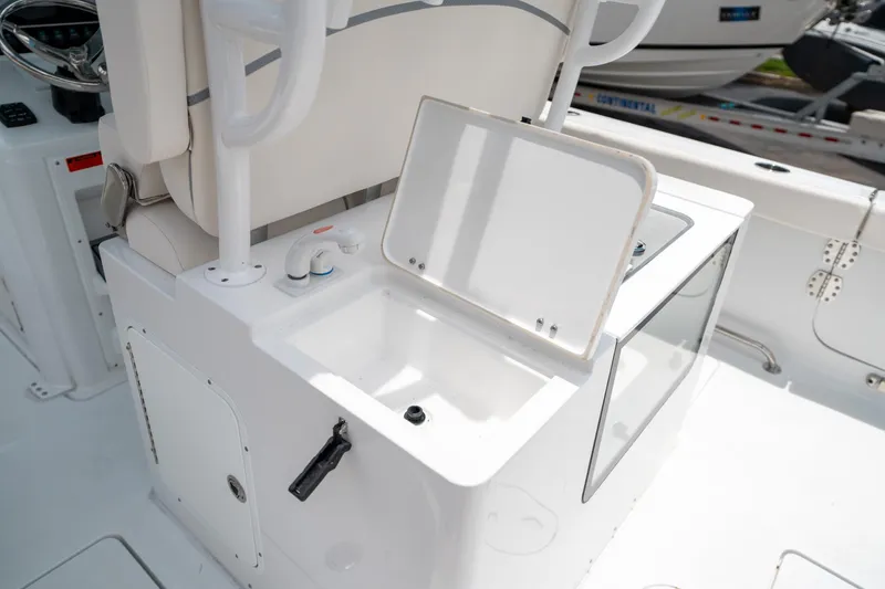 Slide: The Image of 2025 Sea Hunt Gamefish 28 FS boat interior with open storage compartment. - 19