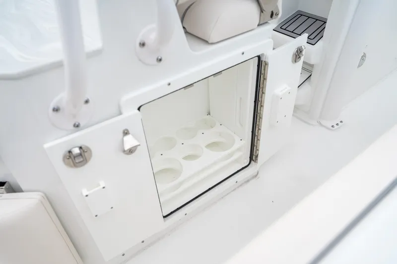 Slide: The Image of Open storage compartment on 2025 Sea Hunt Ultra 239 SE boat. - 32