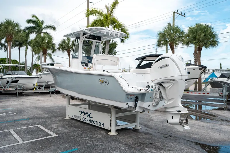 Slide: The Image of 2025 Sea Hunt Ultra 239 SE boat displayed at Marine Connection dealership. - 4
