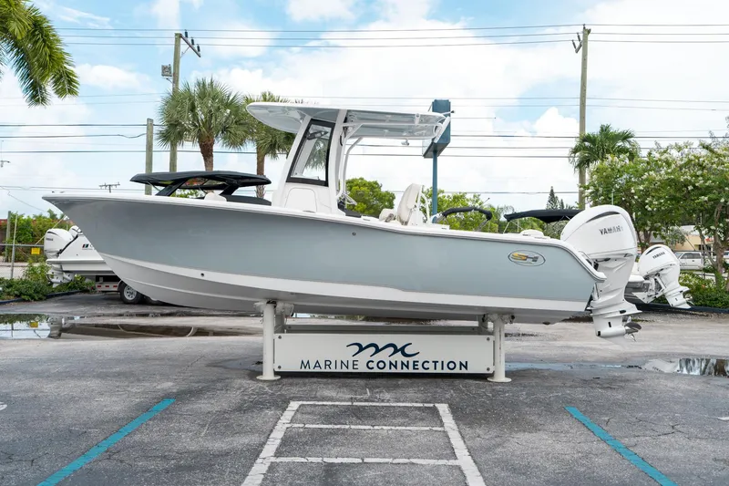 Slide: The Image of 2025 Sea Hunt Ultra 239 SE boat displayed at Marine Connection dealership. - 5