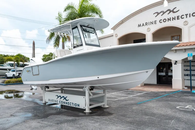 Slide: The Image of 2025 Sea Hunt Ultra 239 SE boat displayed at Marine Connection dealership. - 8