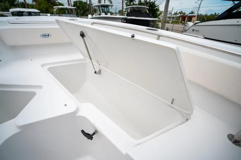 Slide: The Image of Open storage compartment on 2025 Sea Hunt Ultra 239 SE boat. - 49